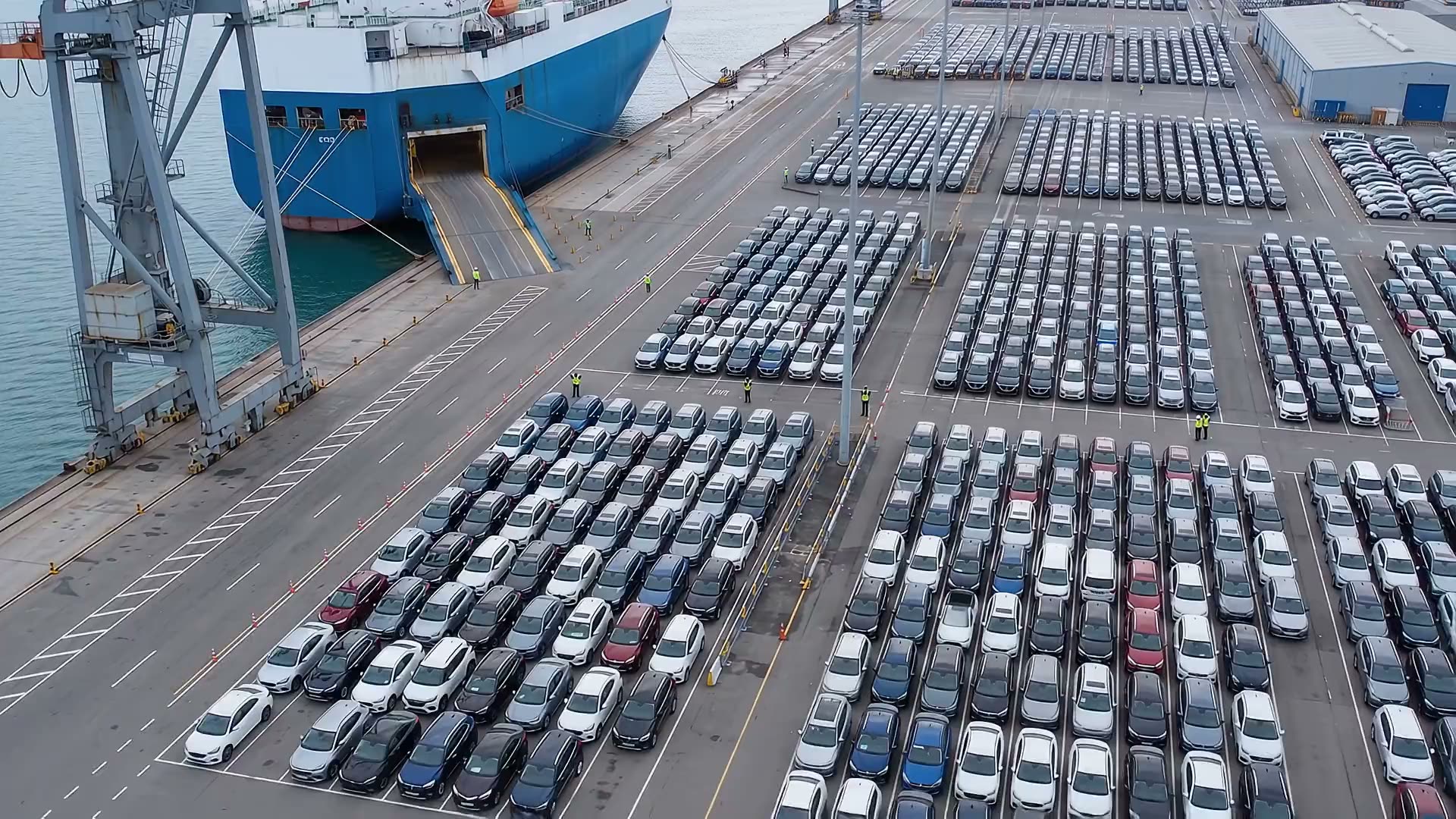 Aerial view of the vehicle storage yard and a RoRo vessel at berth